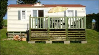 Lors de la vente d'un terrain avec mobil-home, un rapport de contrôle doit-il être joint au dossier technique de vente ?